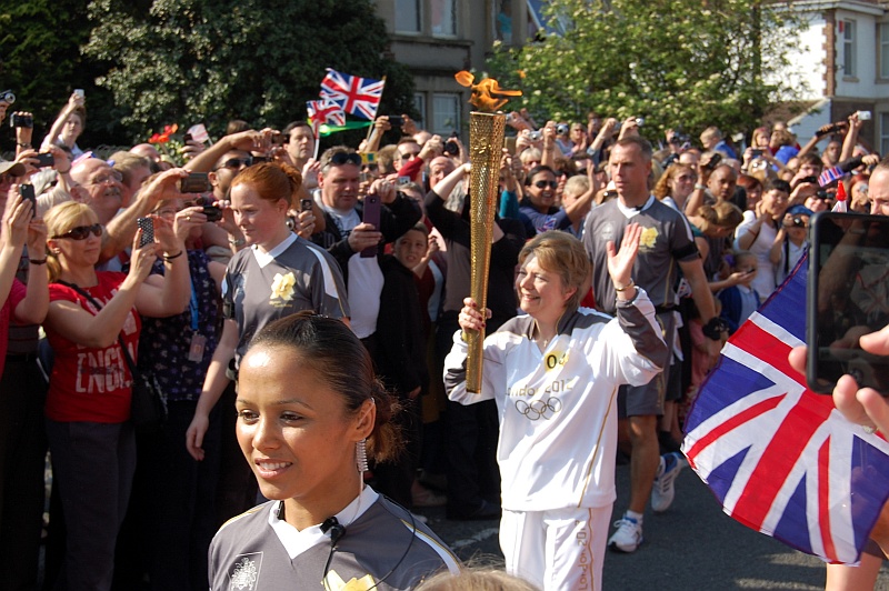 Olympic Torchbearer Corinne Day is welcomed by the crowds in Filton.