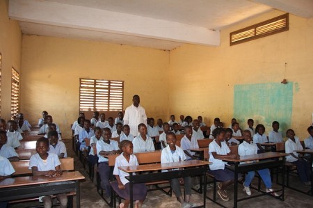 Classroom of children with their new desks at a school in Mozambique.