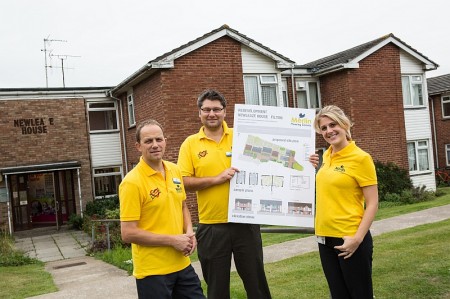 Merlin staff with the plans for the redevelopment of Newleaze House in Filton.